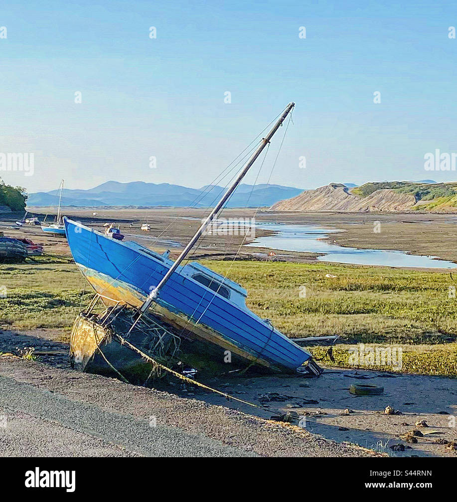 Walney channel view from Promenade towards the old slag banks of Barrow in Furness and Lake District and Furness fells beyond Stock Photo