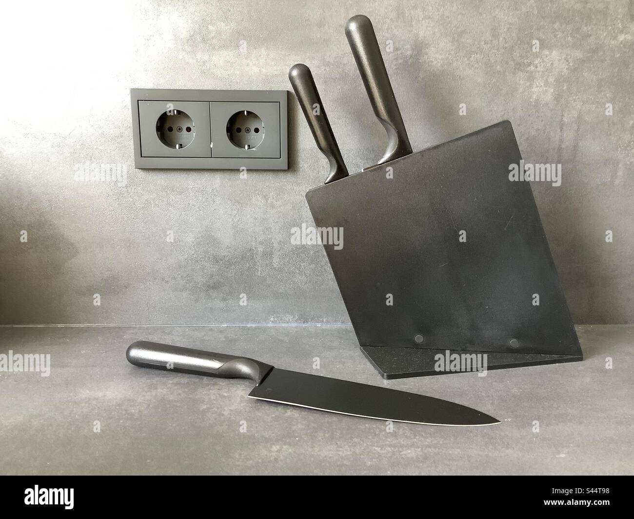 Black design of sockets and a knife block Stock Photo Alamy