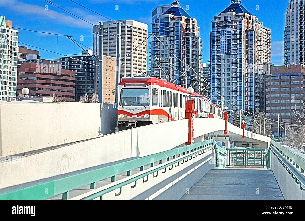 C train, Light Rail Transit, condos in downtown Calgary, Alberta, Canada, Bow River, Bridge - Smartphone Captured Stock Image C train, Light Rail Transit, condos in downtown Calgary, Alberta, Canada, Bow River, Bridge - Smartphone Captured Stock Image