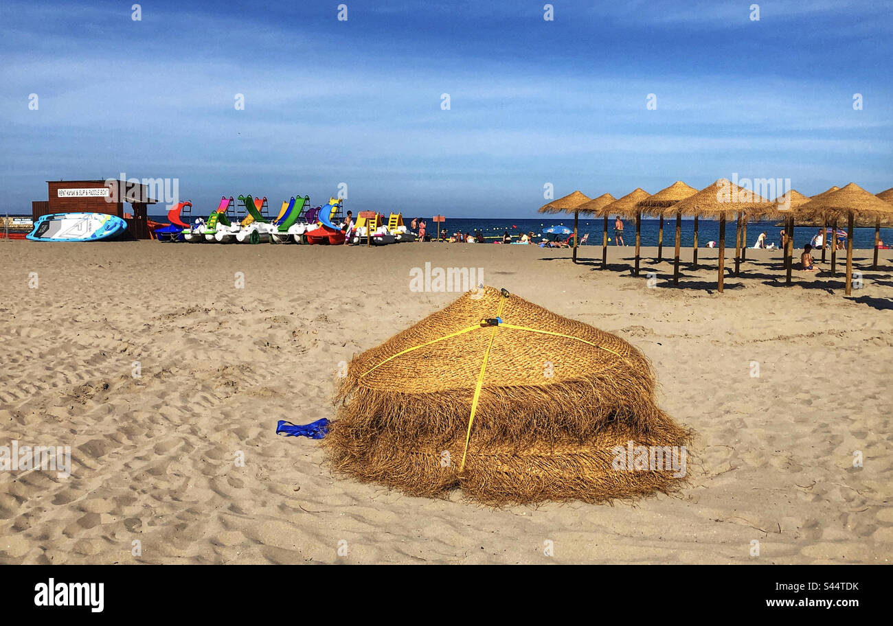 Parasols and pedalos at Arenal Beach, Playa Del Arenal, Javea, Spain Stock  Photo - Alamy