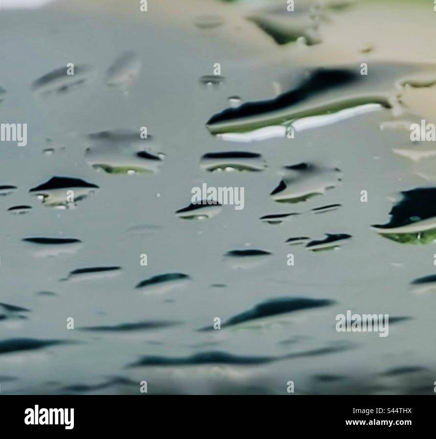 Closeup of raindrops on the windshield. Stock Photo