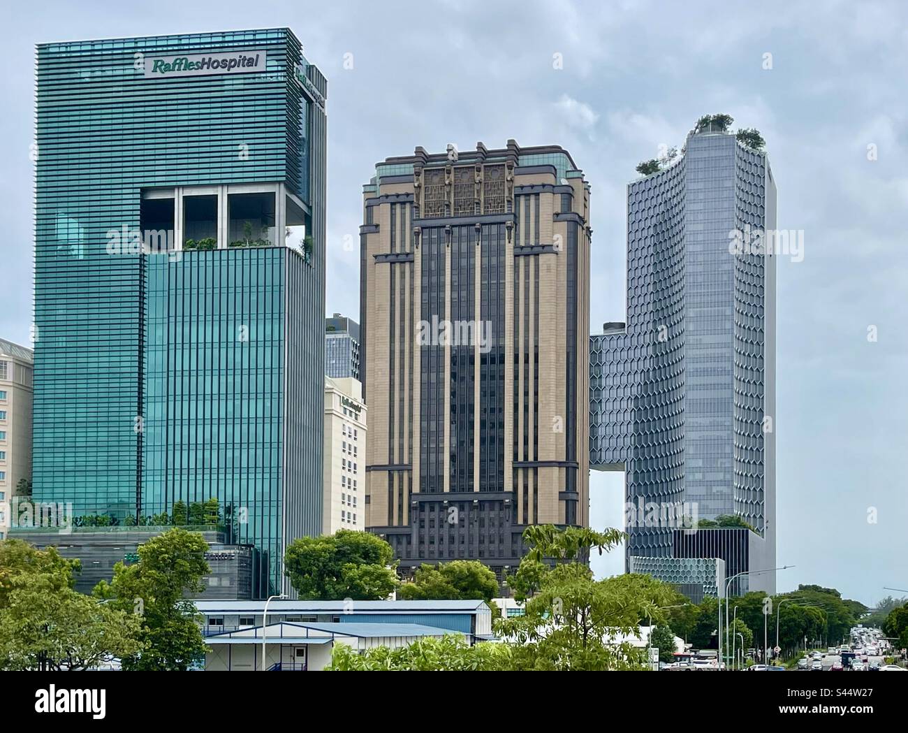 Varied styles of modern architecture of skyscrapers, Raffles Hospital, Parkview Square and Andaz by Hyatt Hotel in Singapore Stock Photo