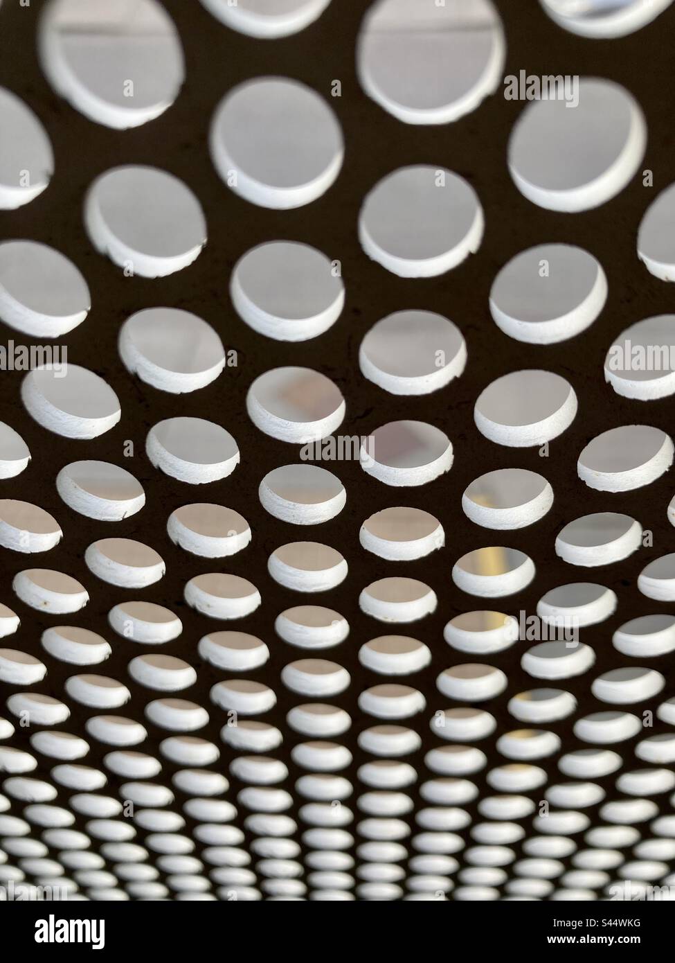Abstract hole punched steel. - Smartphone Captured Stock Image
