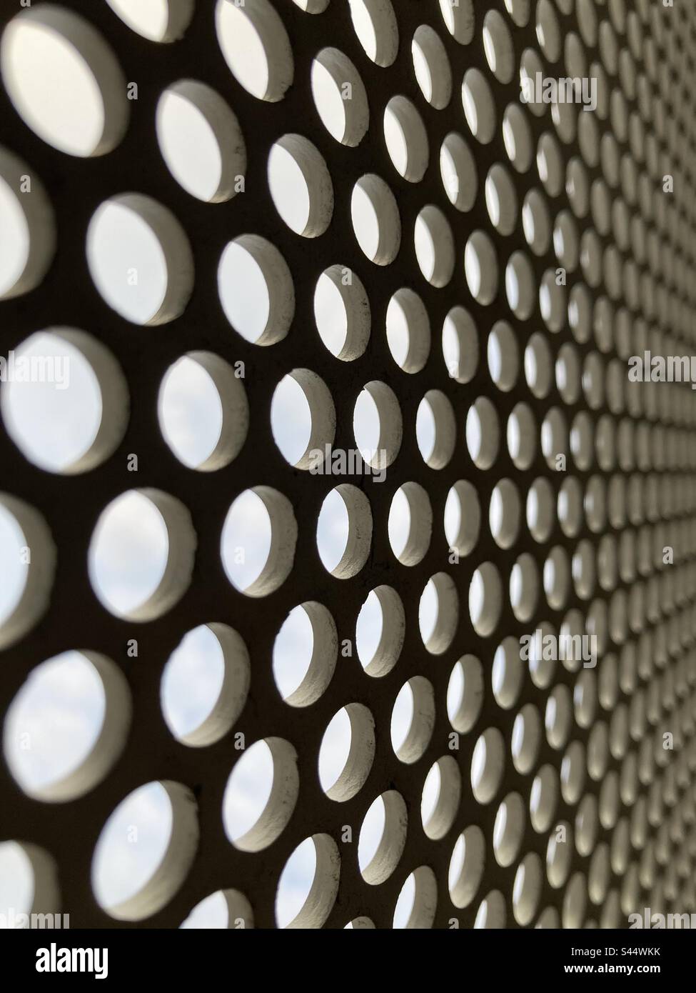 Abstract hole punched steel. - Smartphone Captured Stock Image