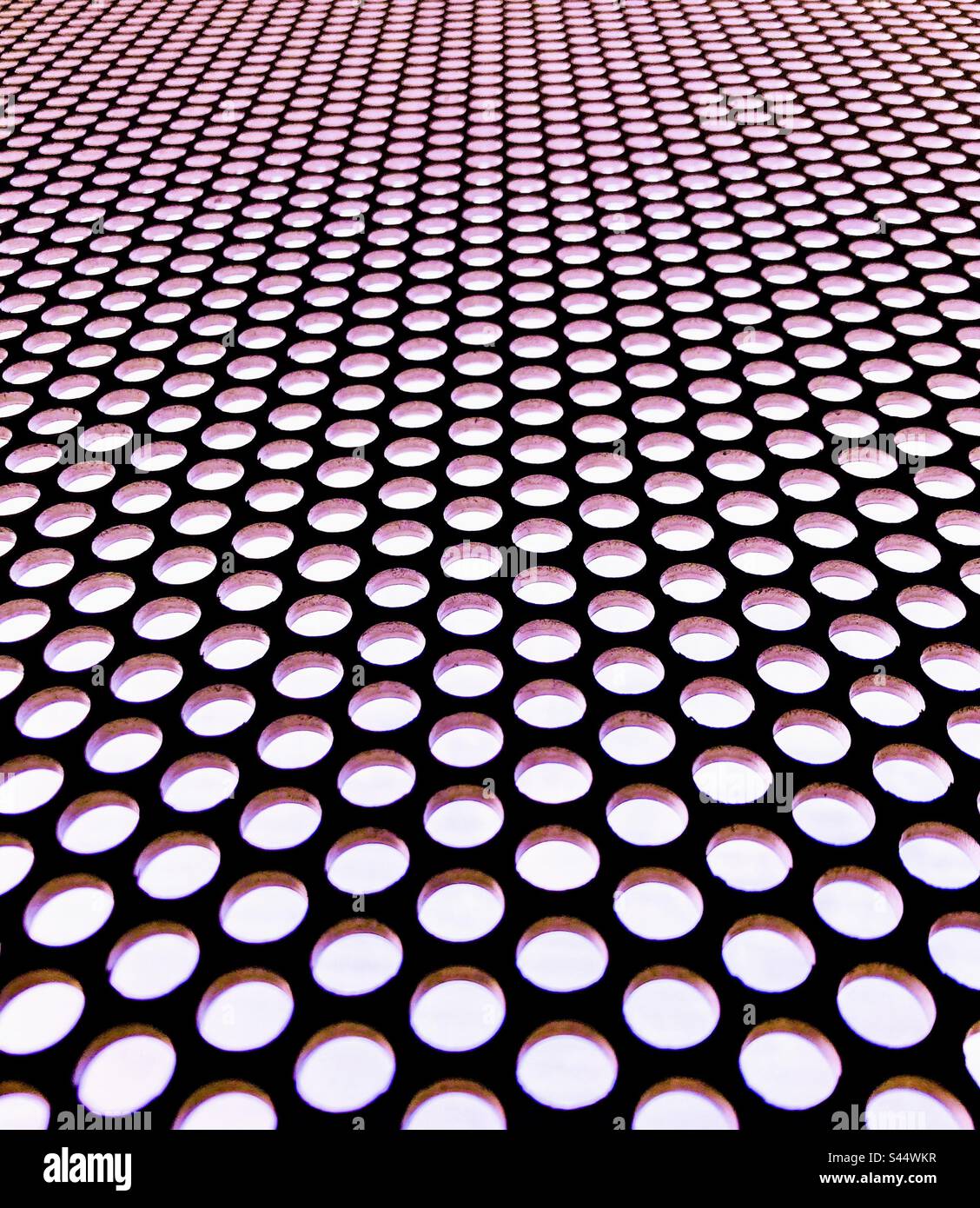 Abstract hole punched steel. - Smartphone Captured Stock Image