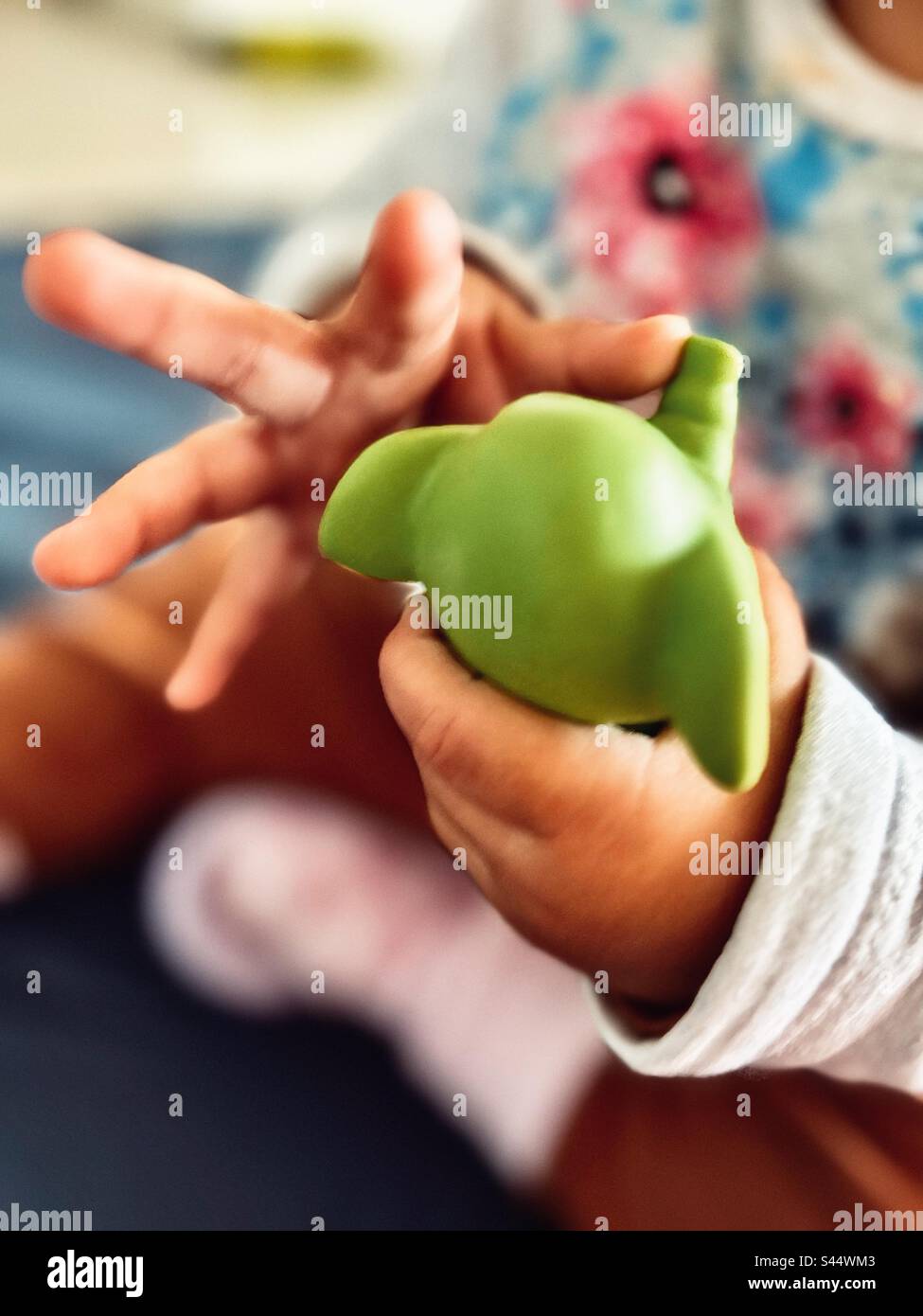 baby hands with her favorite toy Stock Photo