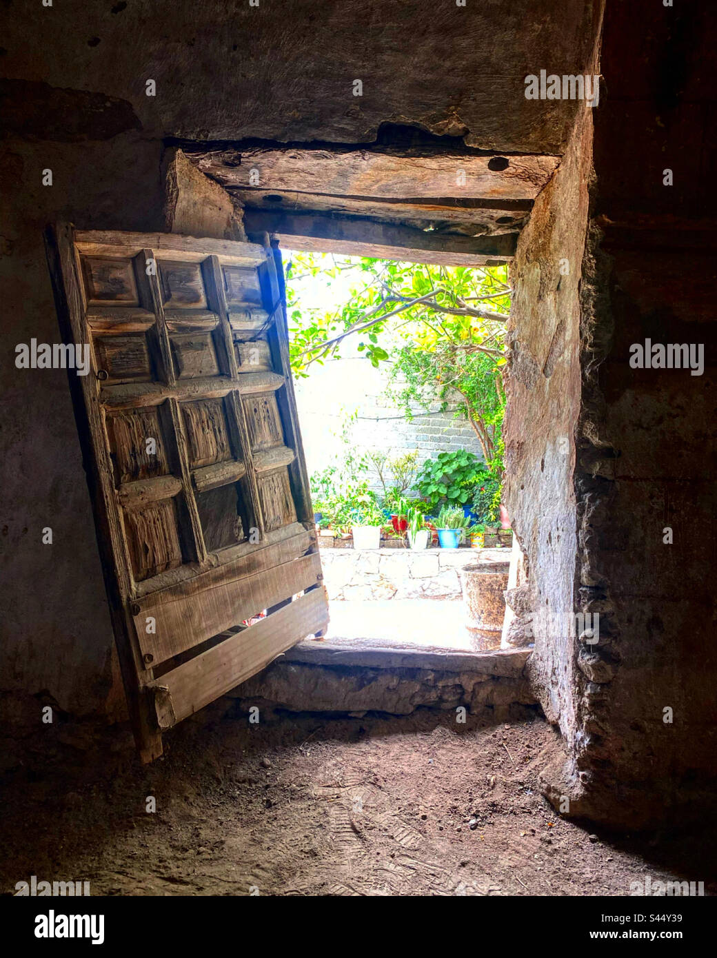 An old wooden door open in the Capilla de los Olvera, San Antonio de la Cal, Toliman, Queretaro, Mexico Stock Photo