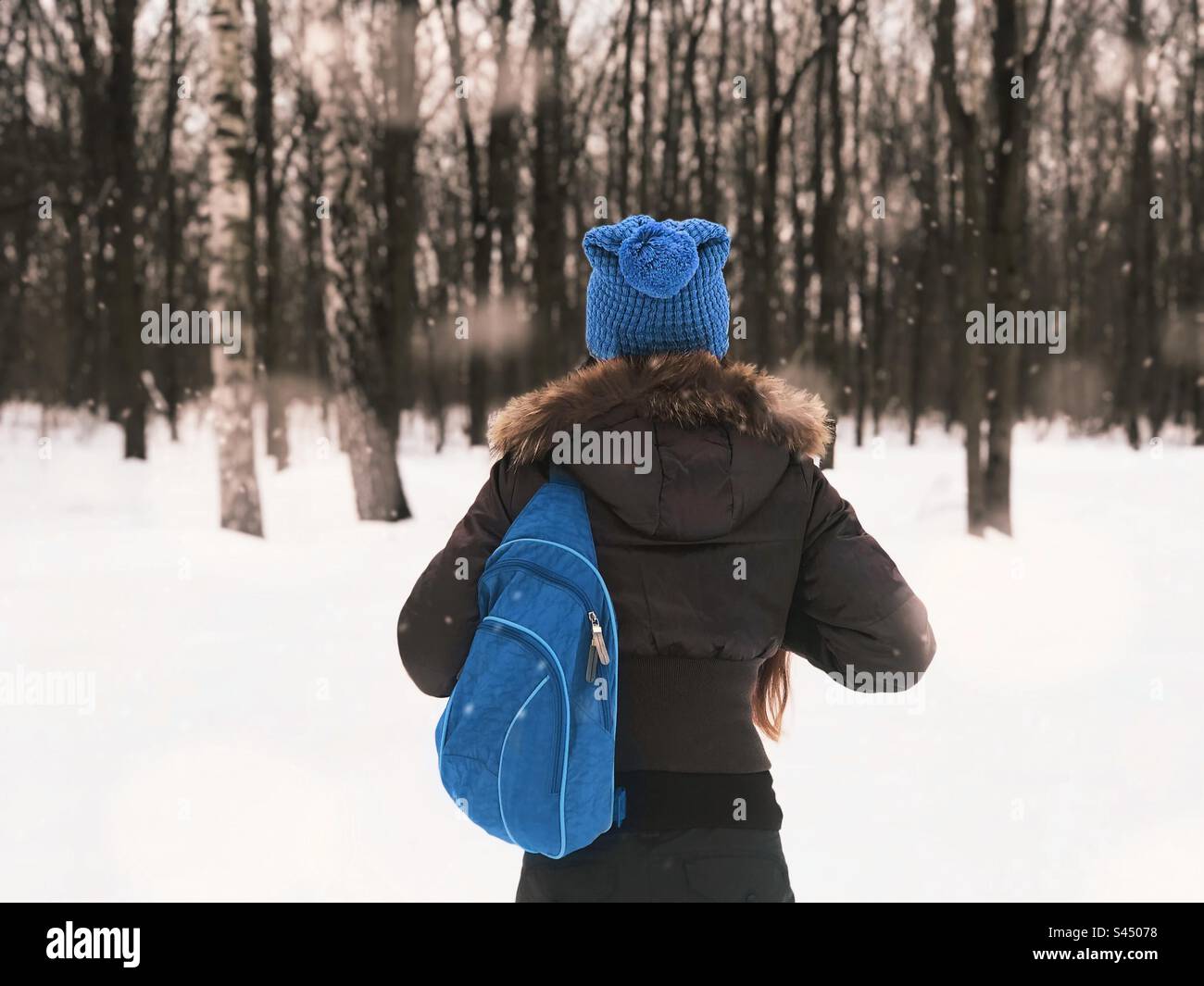 Winter travel with blue backpack - Smartphone Captured Stock Image
