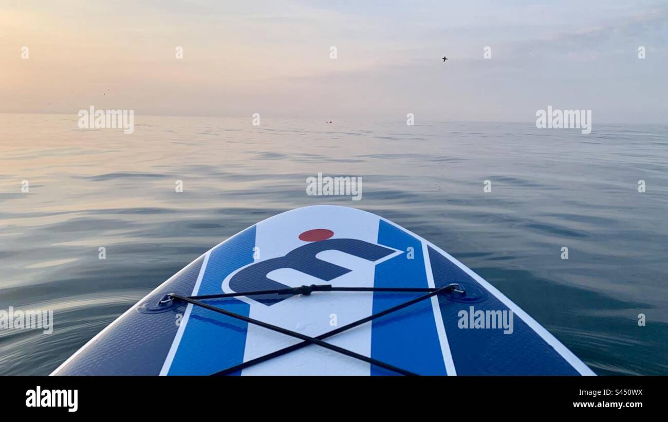 End of paddle board out to sea at sunset - Smartphone Captured Stock Image