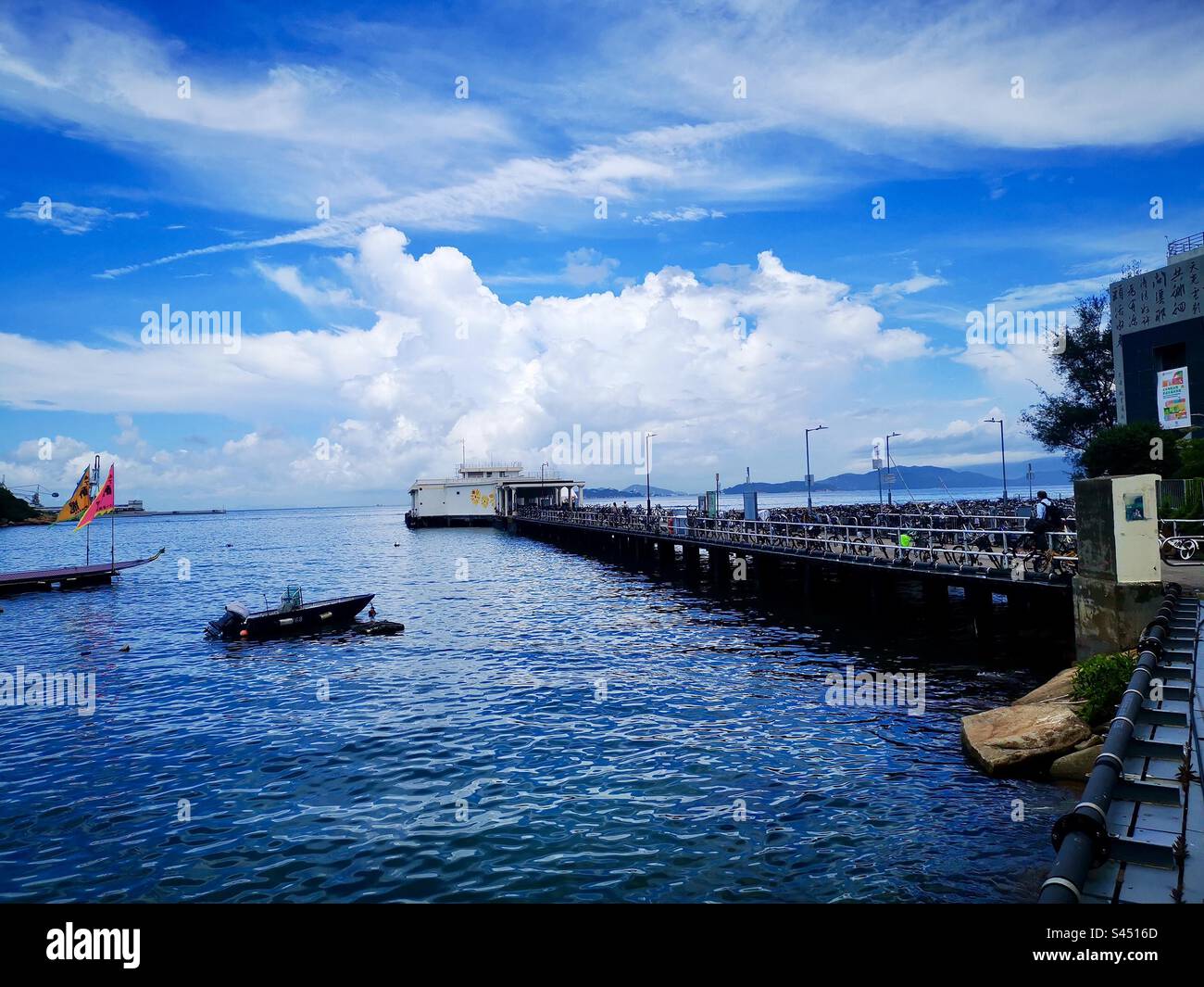 The yung Shue Wan ferry pier on Lamma island in Hong Kong. - Smartphone Captured Stock Image