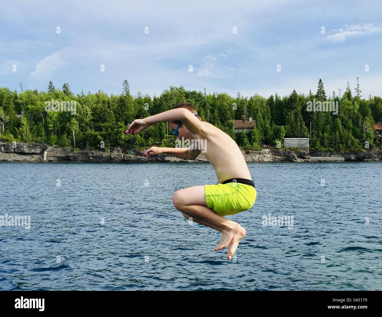 Jumping into summer. Stock Photo