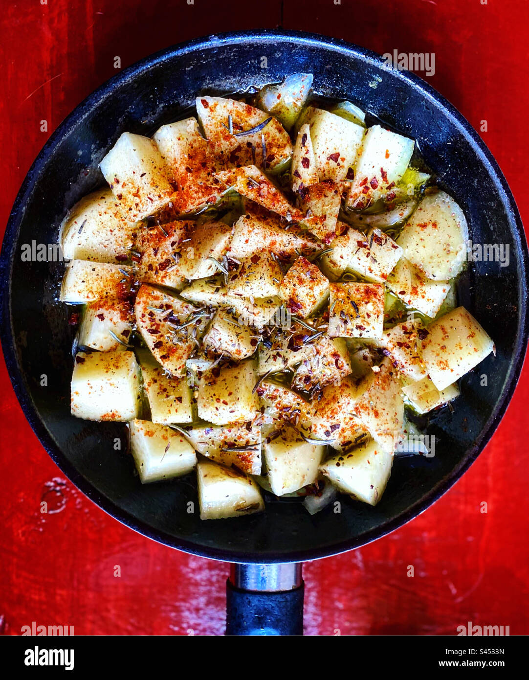 Potatoes with chiles and fine herbs ready to be fried in Queretaro, Mexico - Smartphone Captured Stock Image
