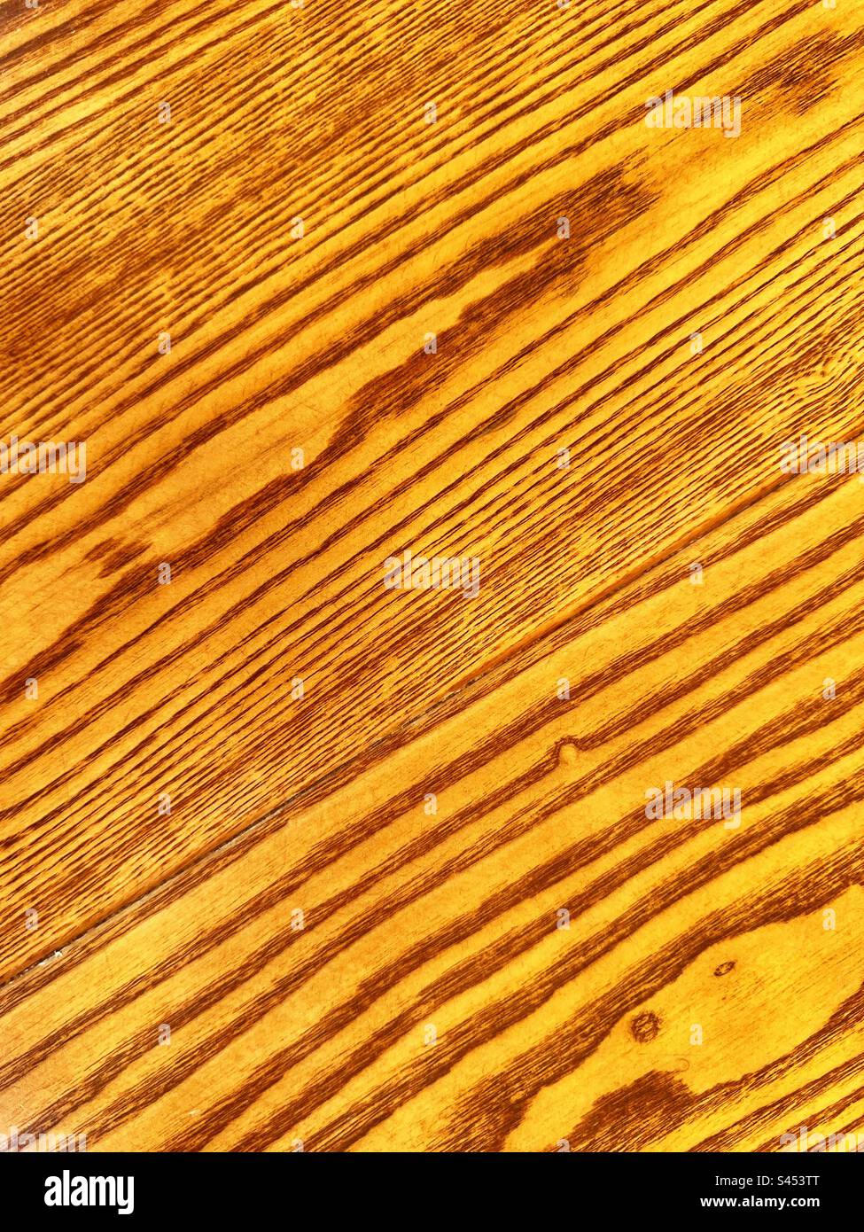 Close up view of the grain on a wooden table top. Backgrounds. No people. Stock Photo