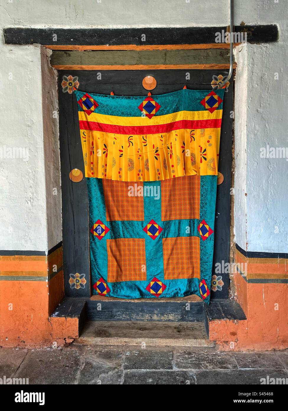 Traditional door curtain at a Buddhist temple in Bhutan. - Smartphone Captured Stock Image