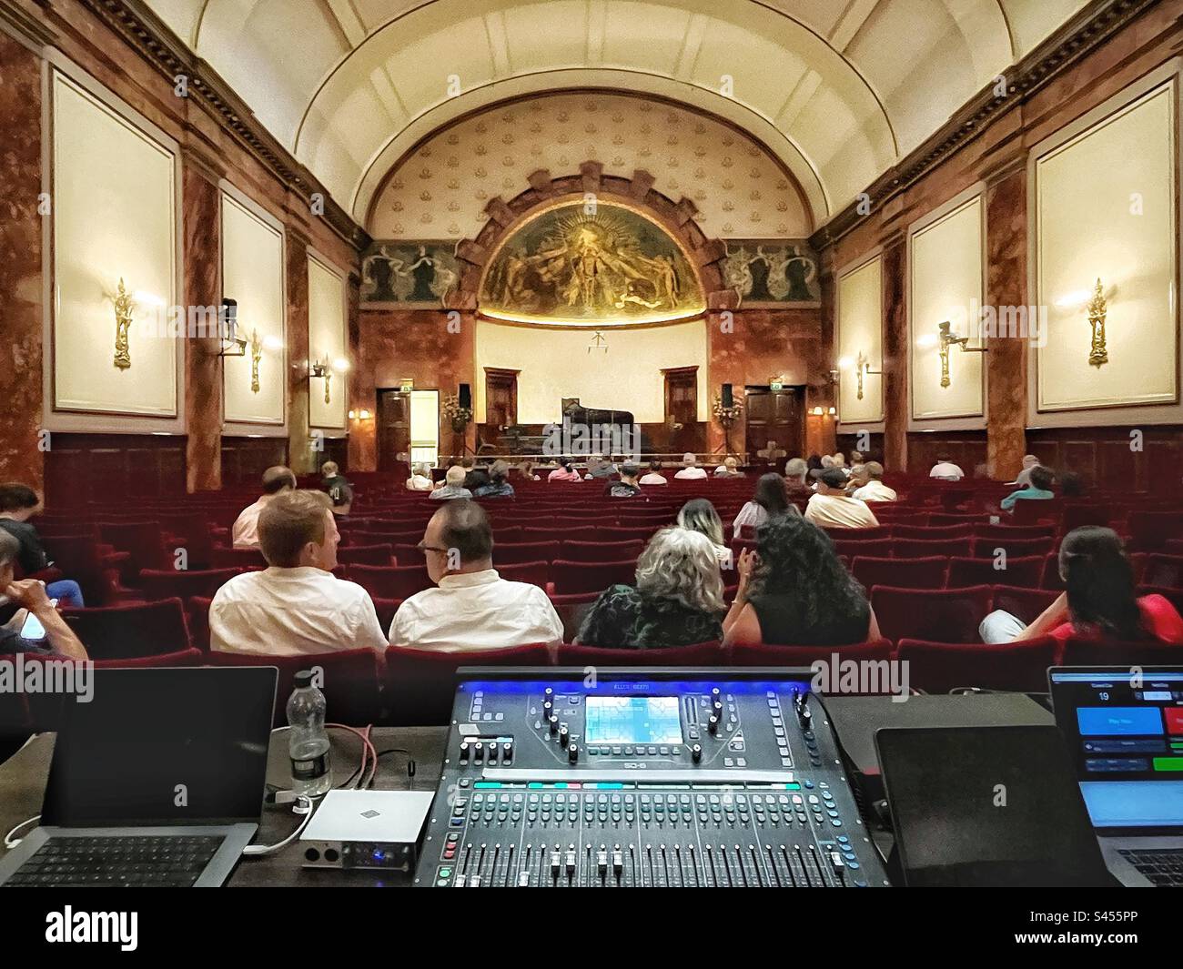 Modern mixing desk in the splendour of the listed building that is the Wigmore Hall in London - audience looks forward - Smartphone Captured Stock Image