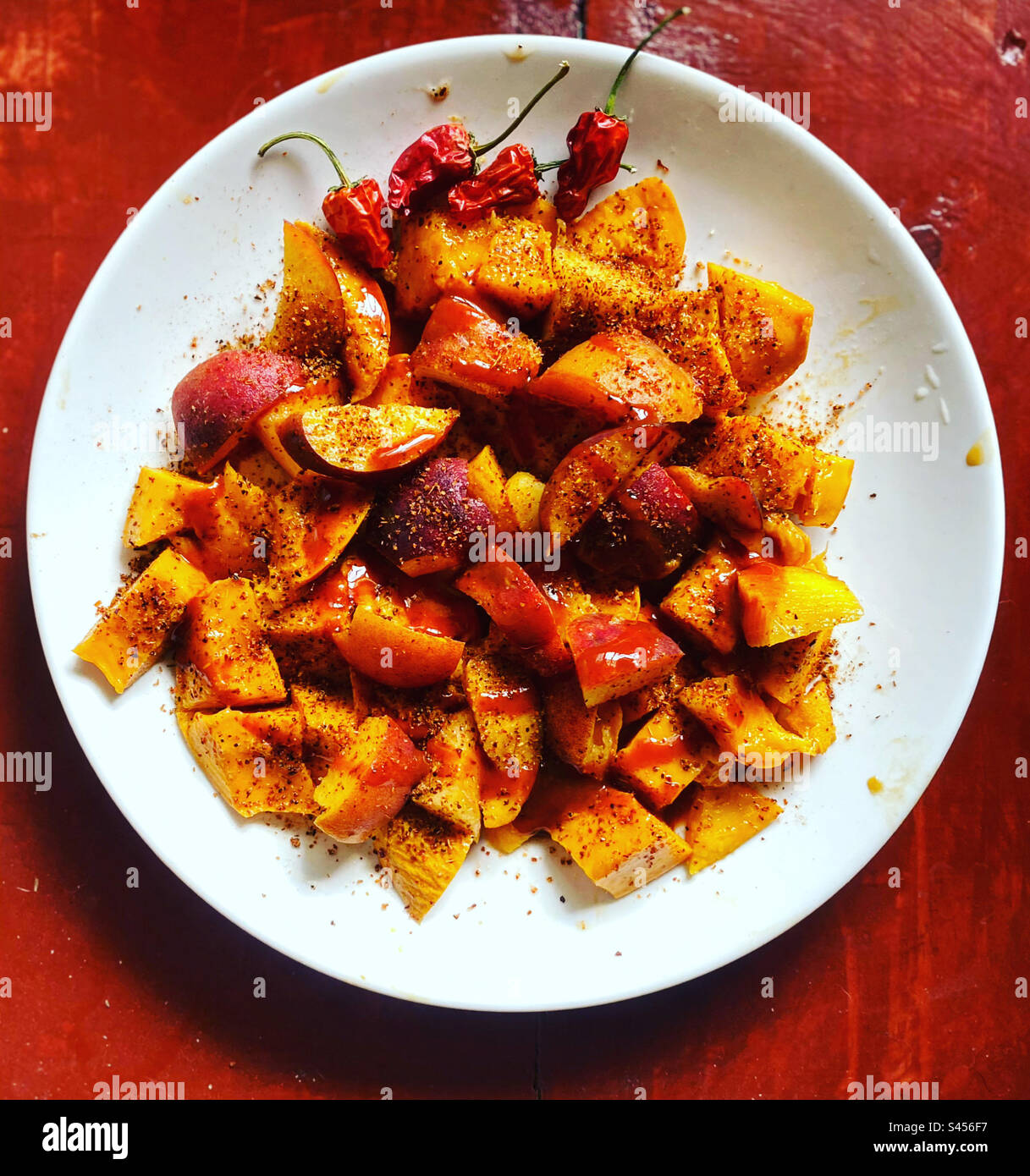 Peach and mango fruit with spicy chilli in Queretaro, Mexico Stock Photo