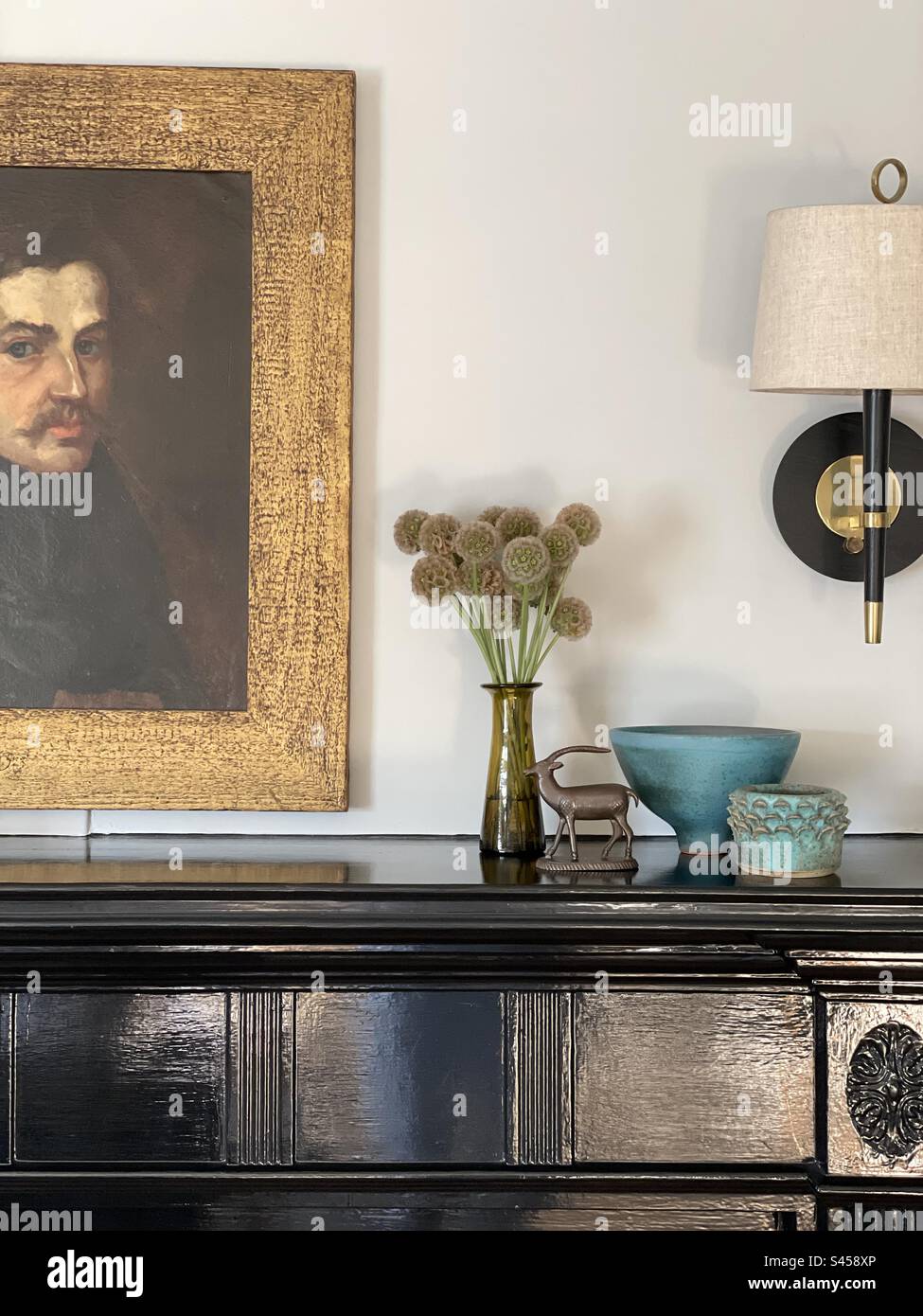 Vignette shot of a bureau decorated with various objets - Smartphone Captured Stock Image
