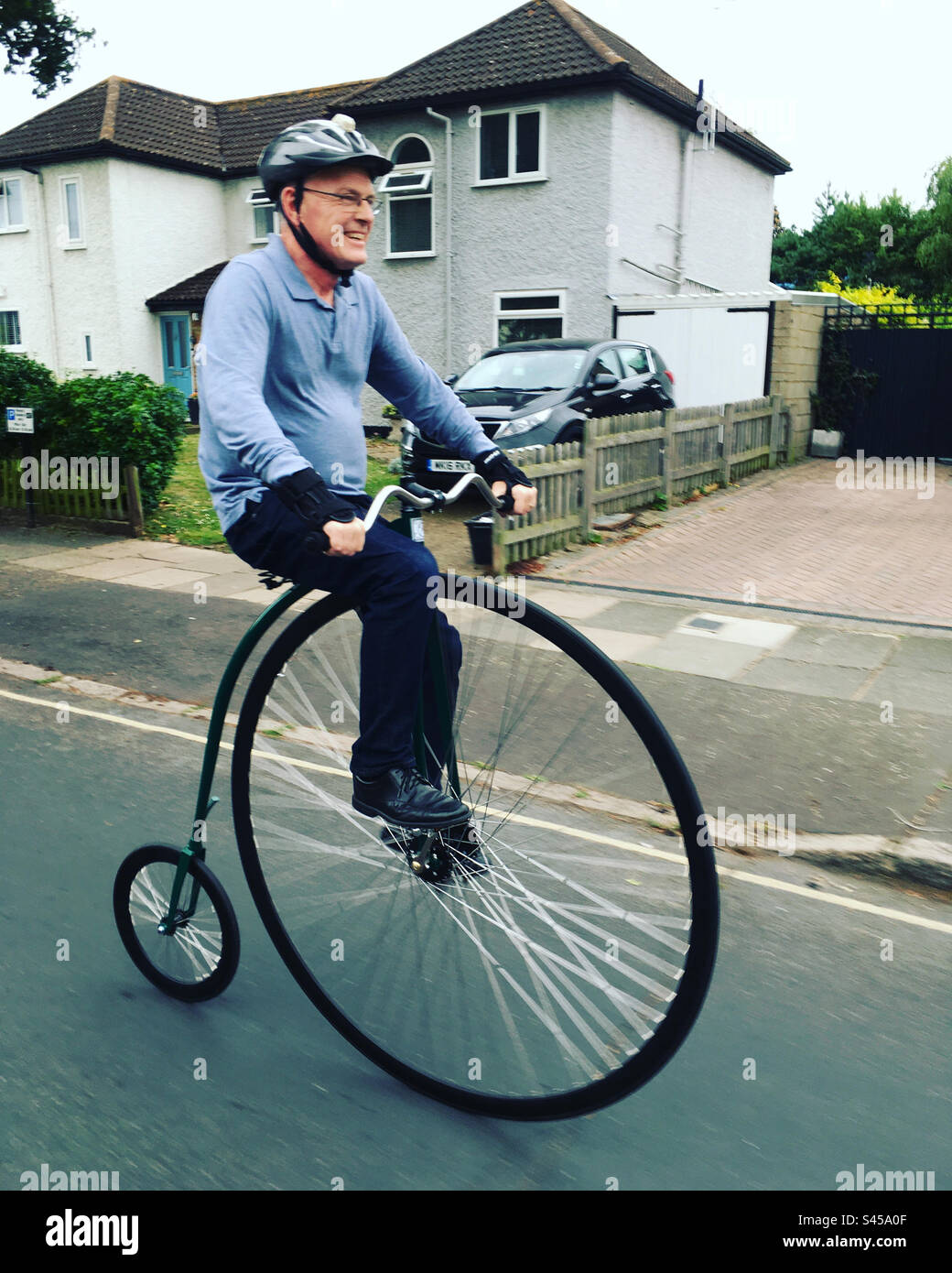 Cyclist riding a Penny farthing bicycle bike in Twickenham West
