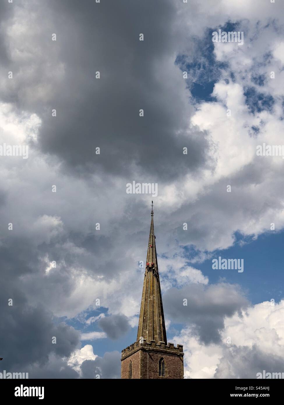 Steeplejacks at work. Lydney, St Mary The Virgin Church. - Smartphone Captured Stock Image
