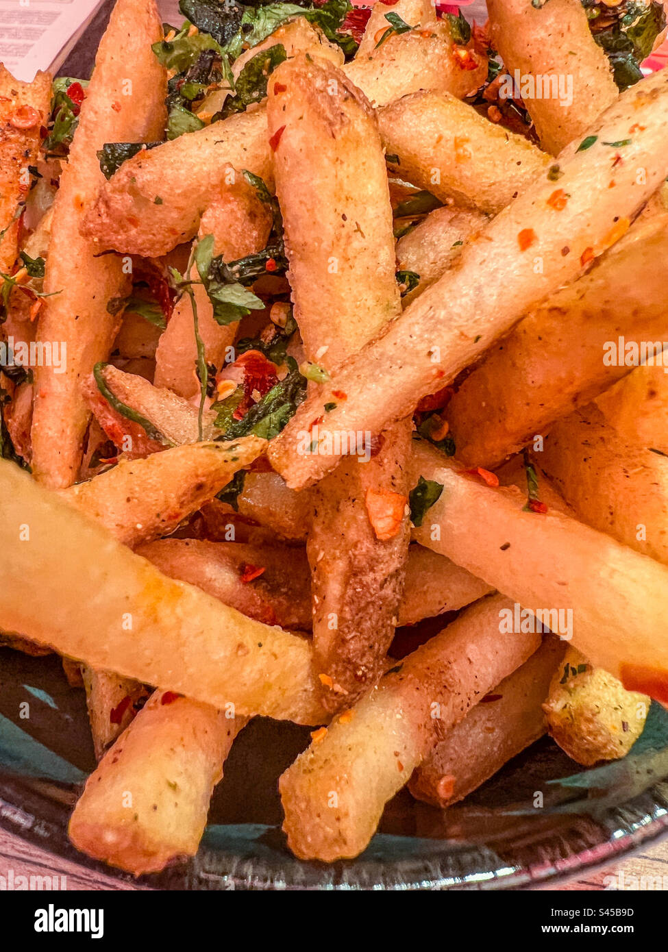 Bowl of spicy fries Stock Photo