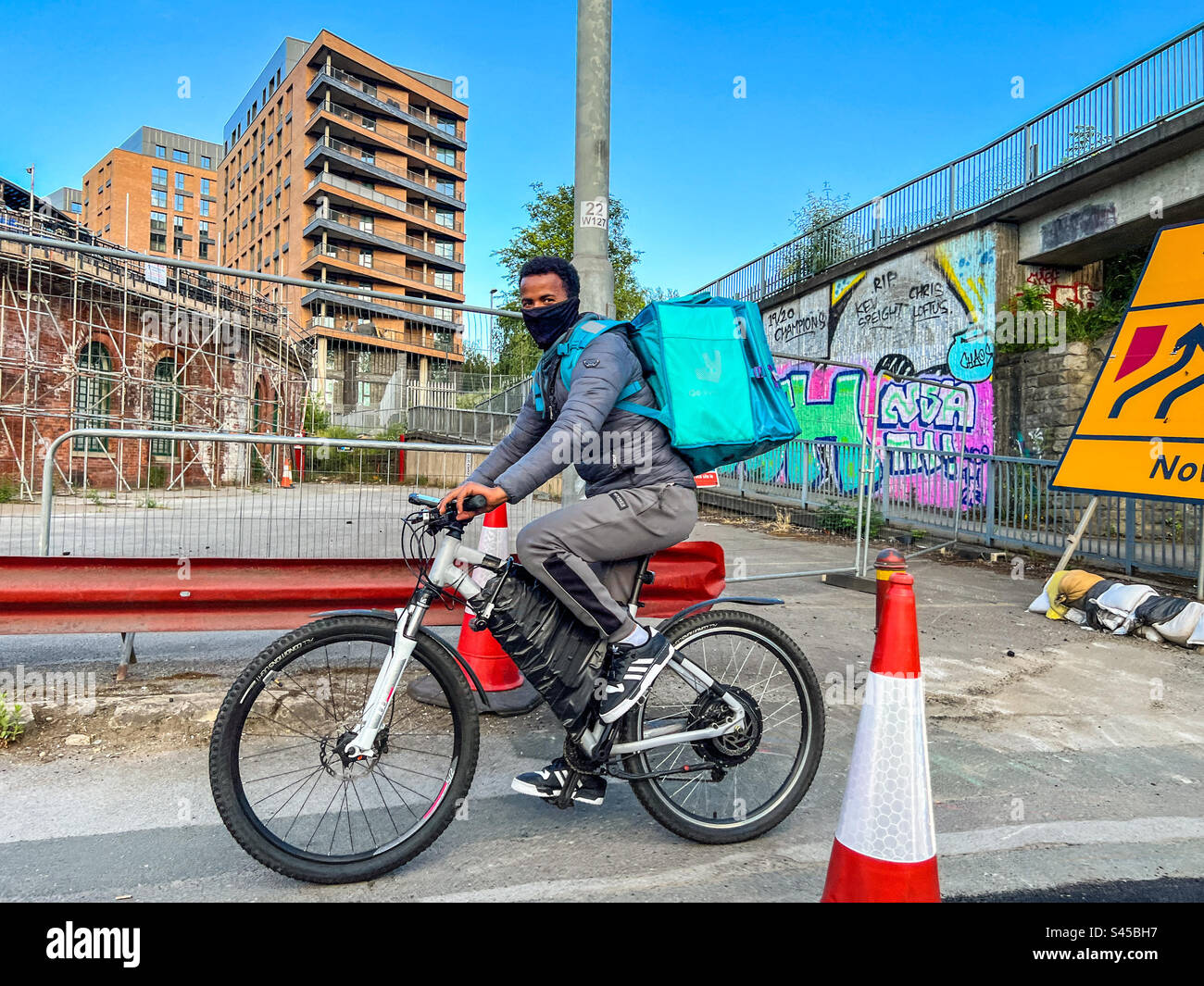 Deliveroo cyclist with takeaway in Leeds City Centre - Smartphone Captured Stock Image
