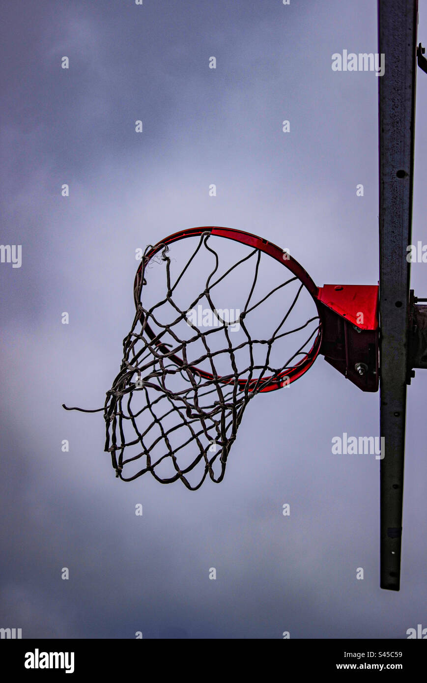 Basketball hoop on a overcast day Stock Photo - Alamy