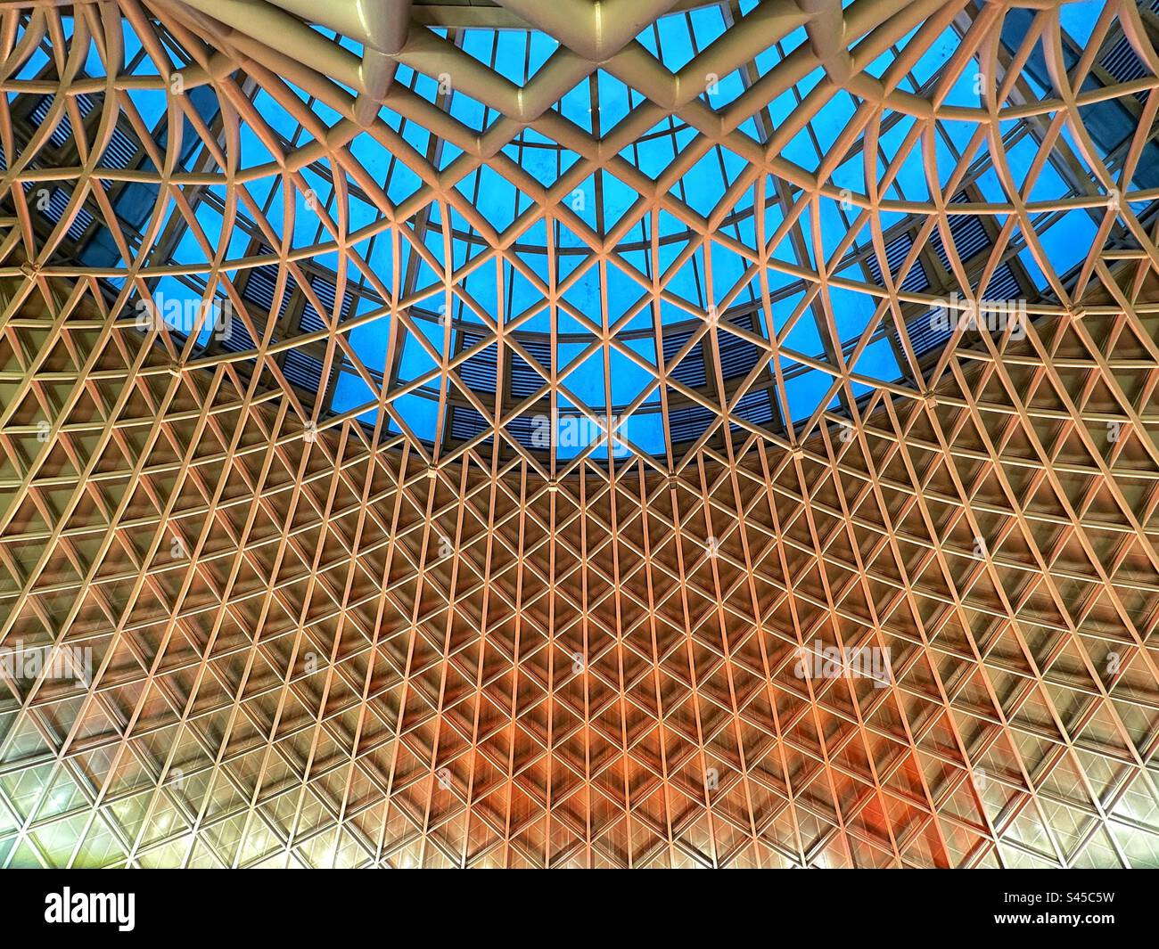 Interior view of the roof architecture of King’s Cross railway station in central London. No people. Stock Photo