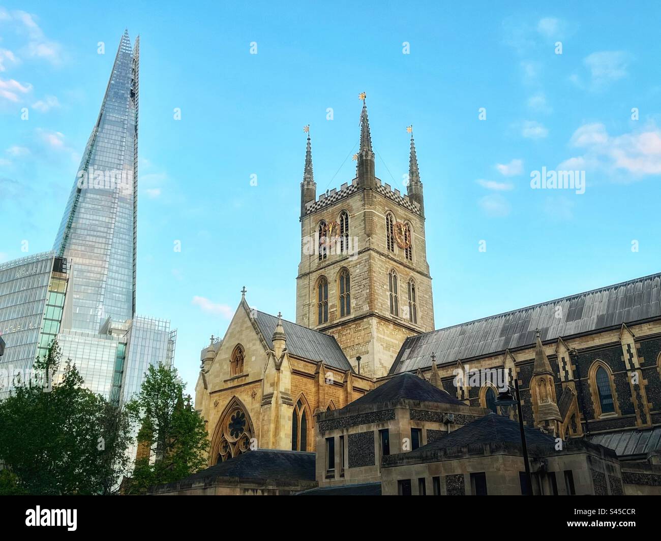 The Shard modern architecture and Southwark Cathedral seen together in London. Perspective and juxtaposition. Thames Embankment - Smartphone Captured Stock Image