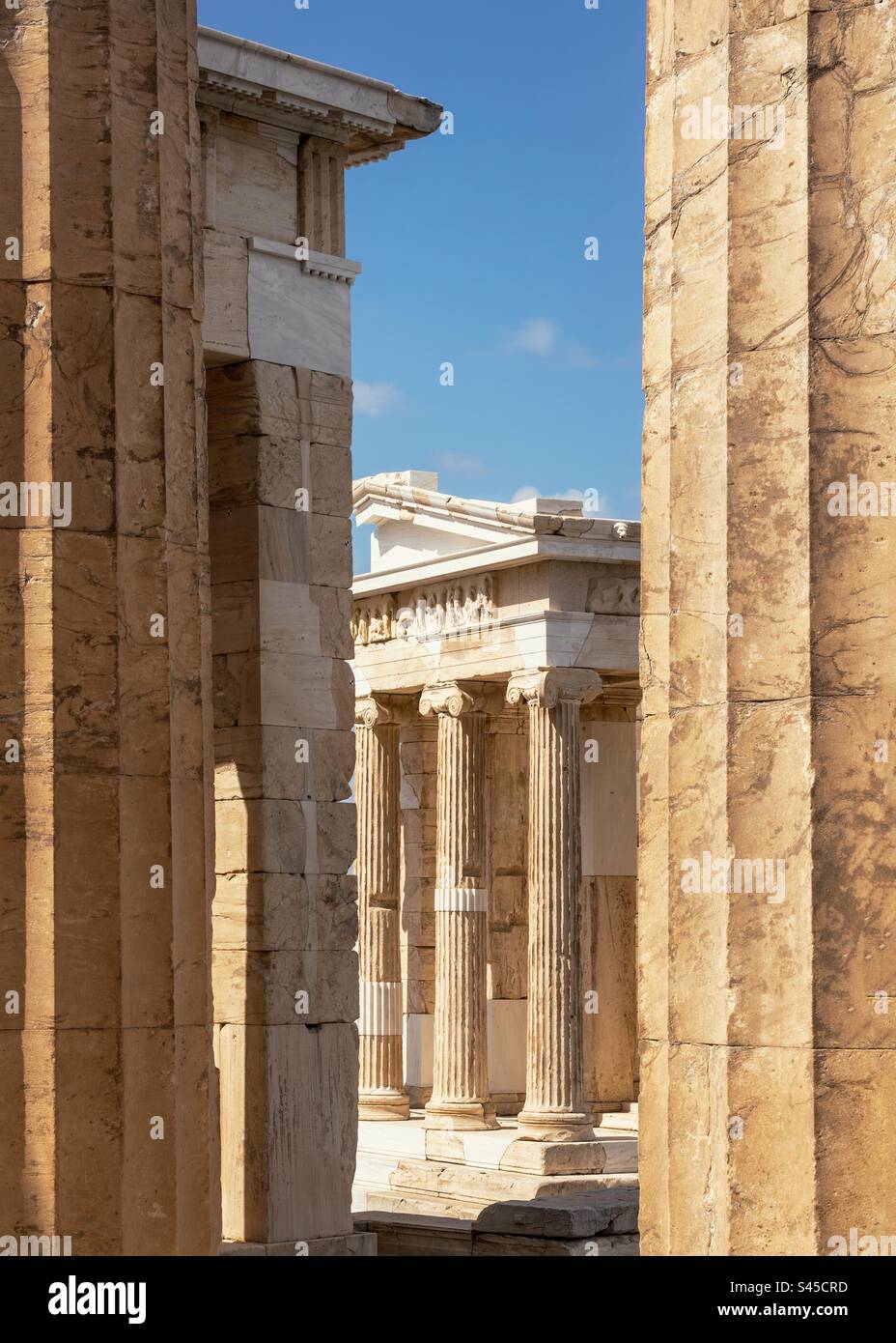 View of the Temple of Athena through the columns of the Acropolis. - Smartphone Captured Stock Image