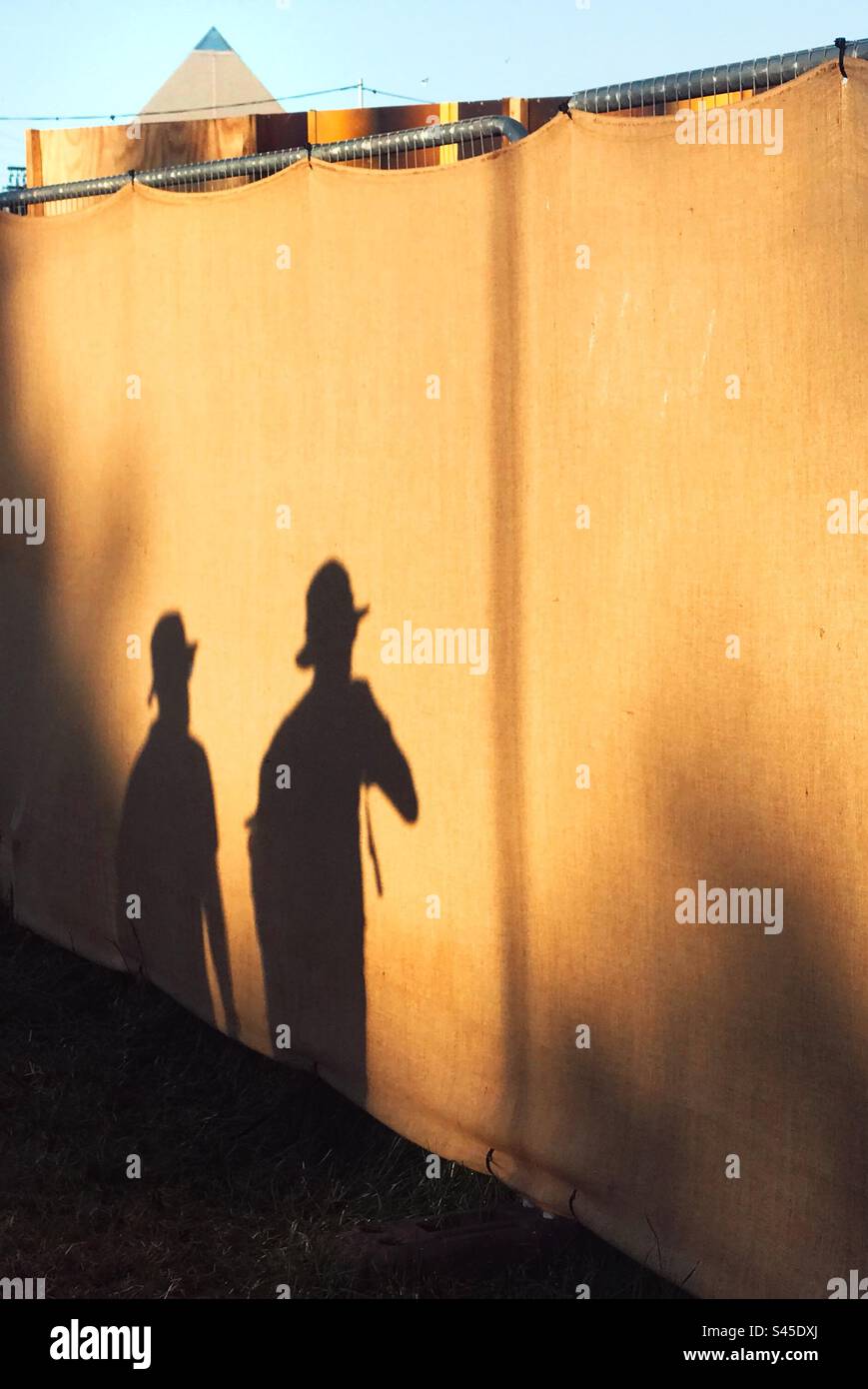 Shadows of people walking at the Glastonbury Festival 2023 - Smartphone Captured Stock Image
