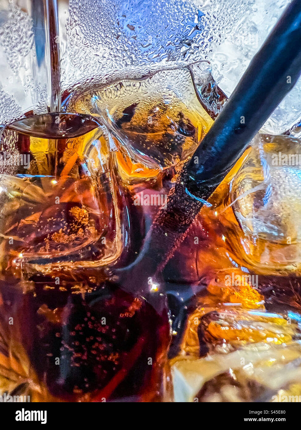 Ice cold glass of cola with straw - Smartphone Captured Stock Image