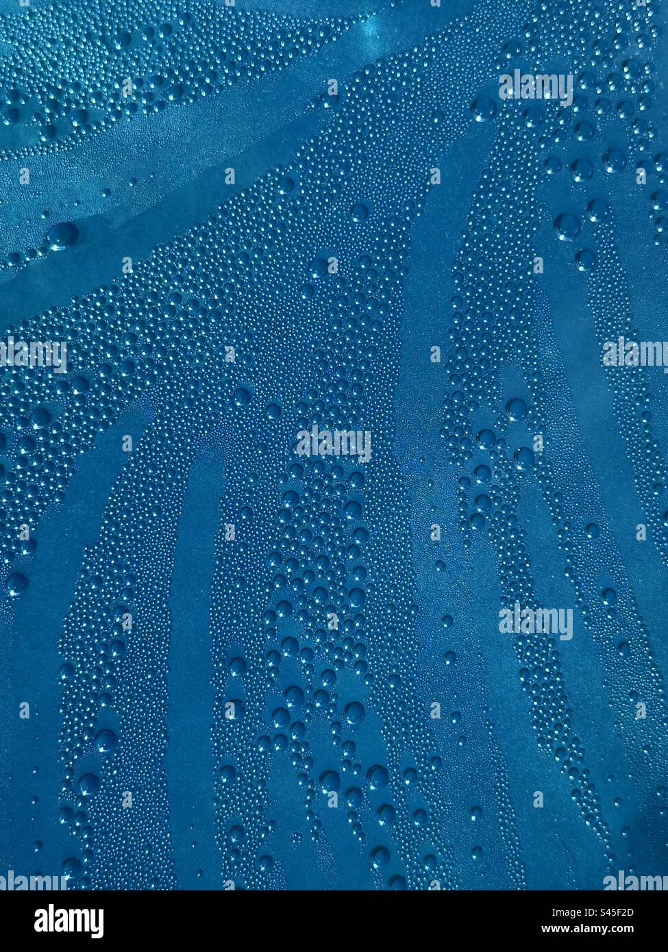 Abstract background of water condensation on blue pool floaty Stock Photo
