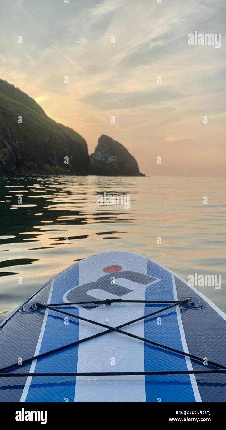 Paddle board on the sea at sunset - Smartphone Captured Stock Image