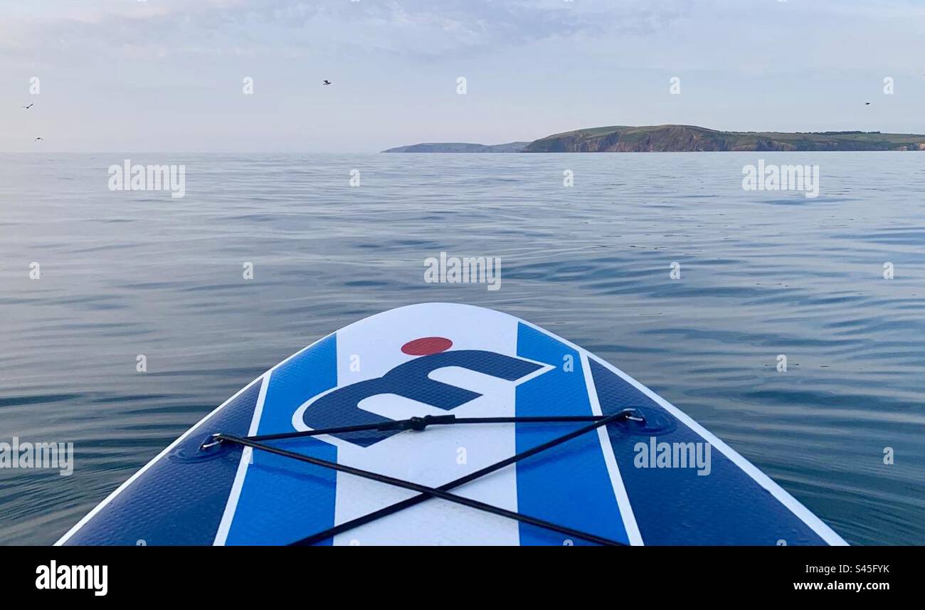 Paddle board on the sea with land on the horizon - Smartphone Captured Stock Image