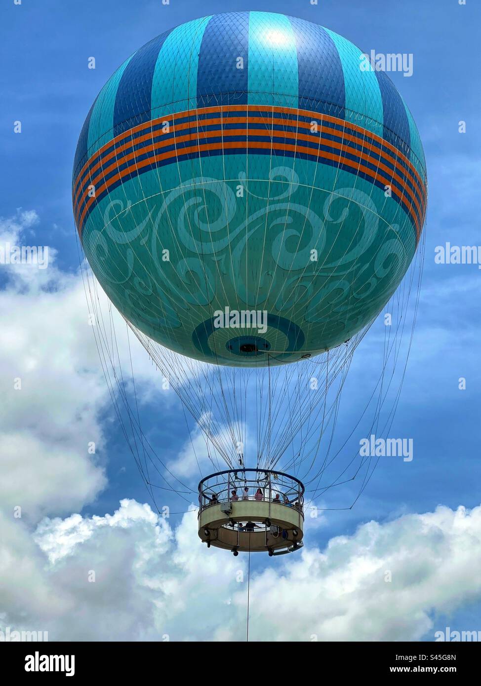 People ascending in a tethered balloon for an aerial view of a tourist