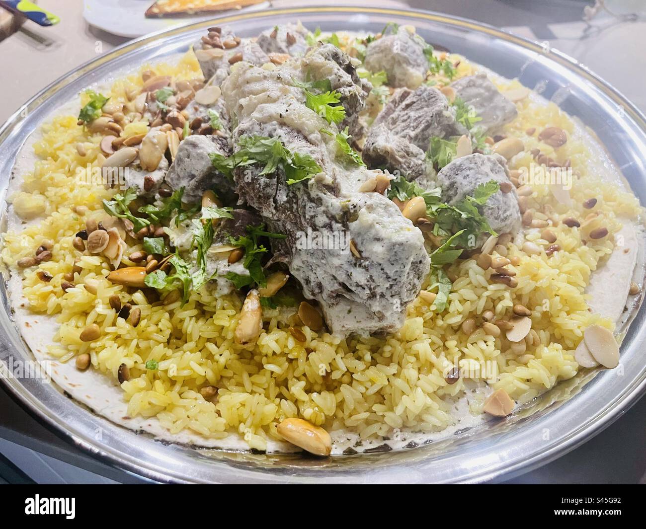 Mansaf is a traditional Levantine dish made out of lamb rice and yoghurt. - Smartphone Captured Stock Image Mansaf is a traditional Levantine dish made out of lamb rice and yoghurt. - Smartphone Captured Stock Image
