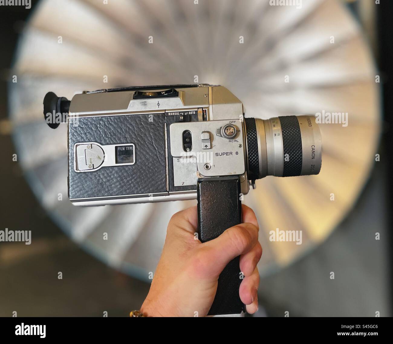 Vintage super 8 film camera with studio lights in the background Stock Photo
