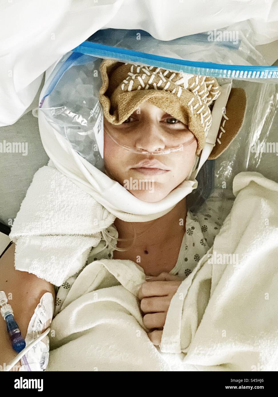 Woman with ice on face after surgery Stock Photo Alamy