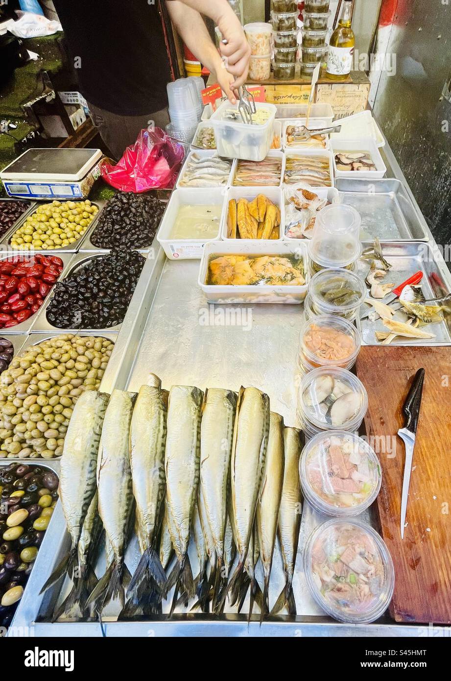 A stall selling smoked fish at the Carmel market in Tel-Aviv, Israel. - Smartphone Captured Stock Image