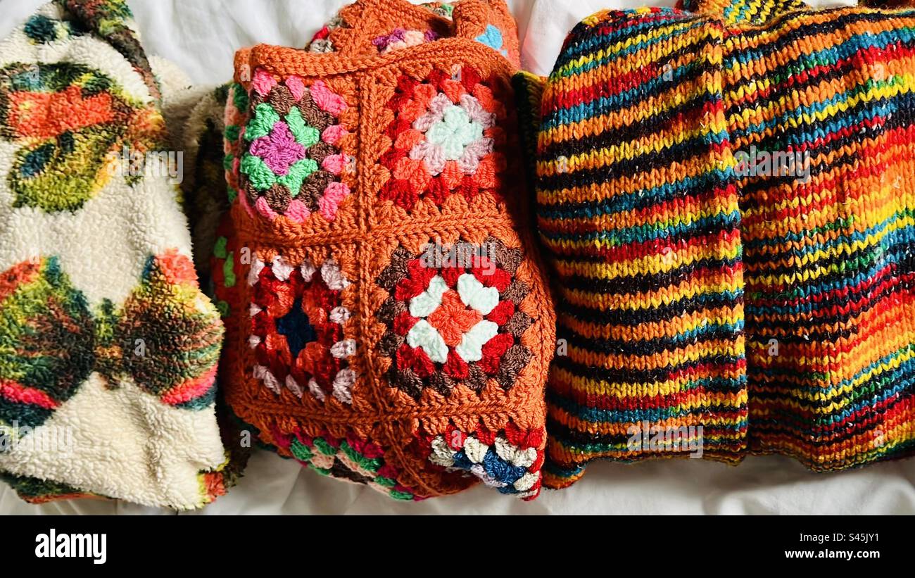 Colourful jumpers. Secondhand and handmade. Stock Photo