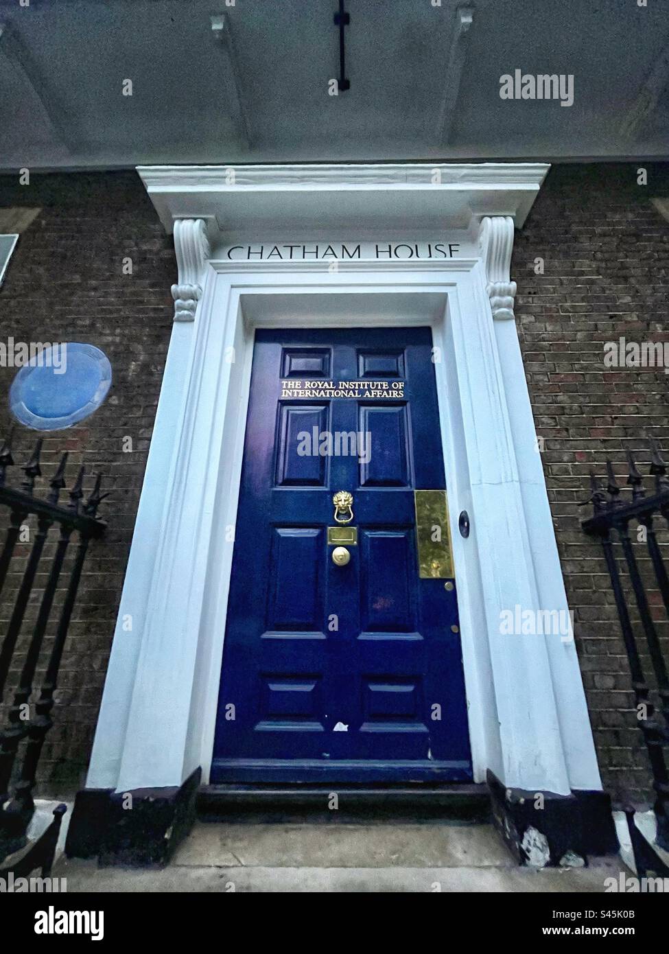 The door to Chatham House - The Royal Institute of International Affairs - in St James’s in London famous for the Chatham House Rule in diplomacy promoting discussion and reconciliation - Smartphone Captured Stock Image