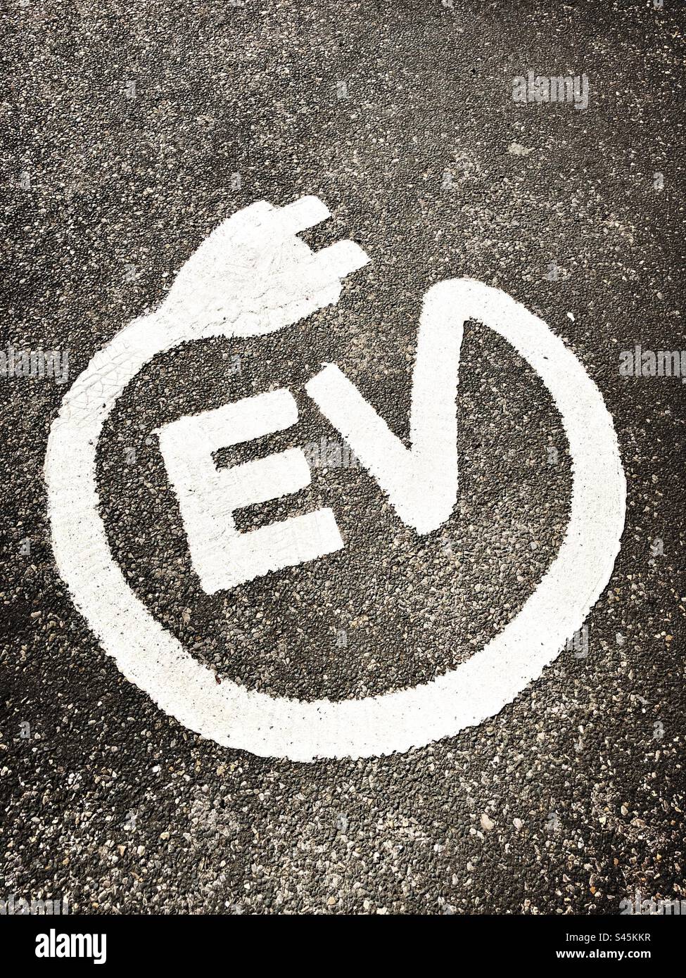 Electric vehicle symbol on the ground, United Kingdom Stock Photo