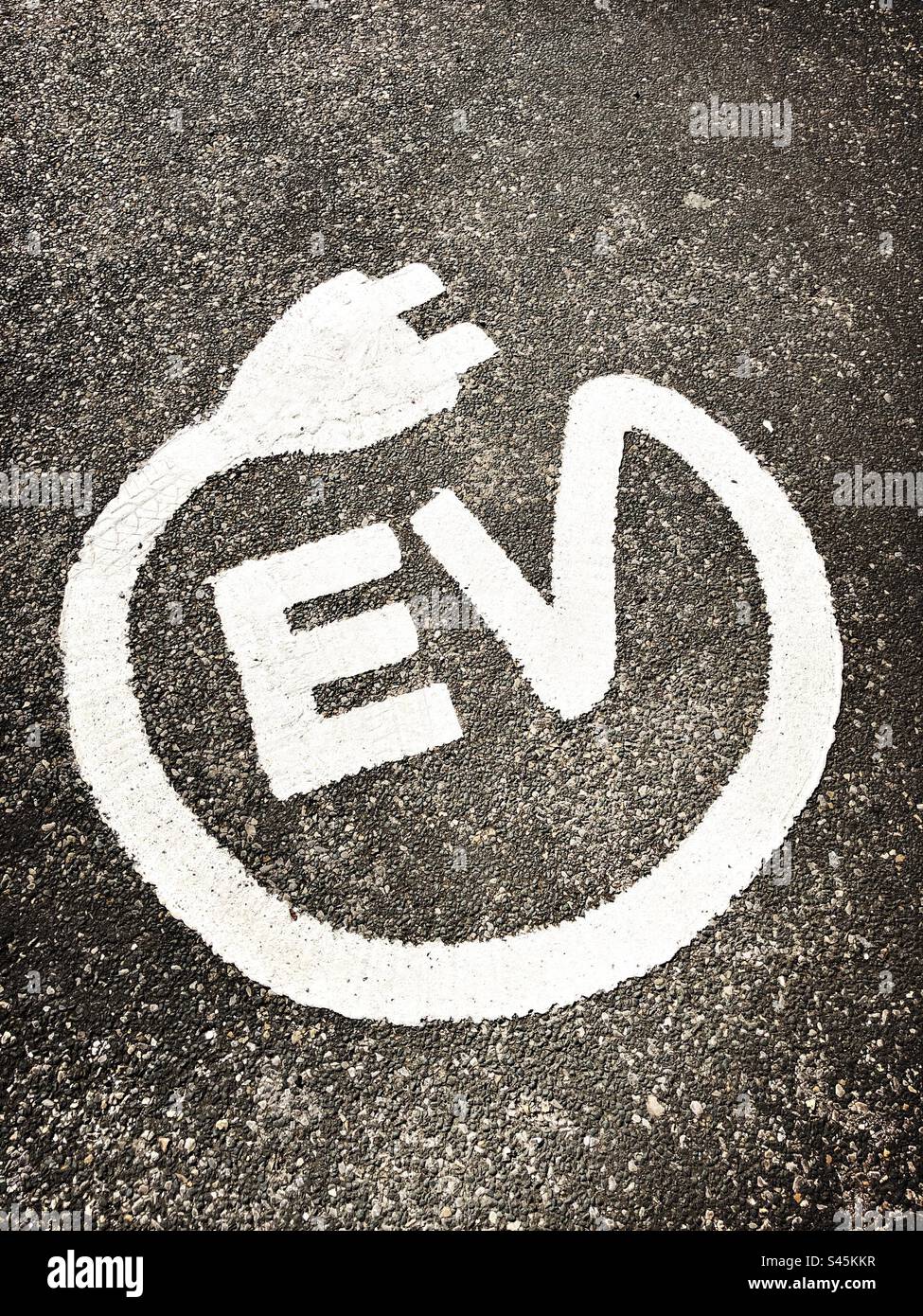 Electric vehicle symbol on the ground, United Kingdom - Smartphone Captured Stock Image