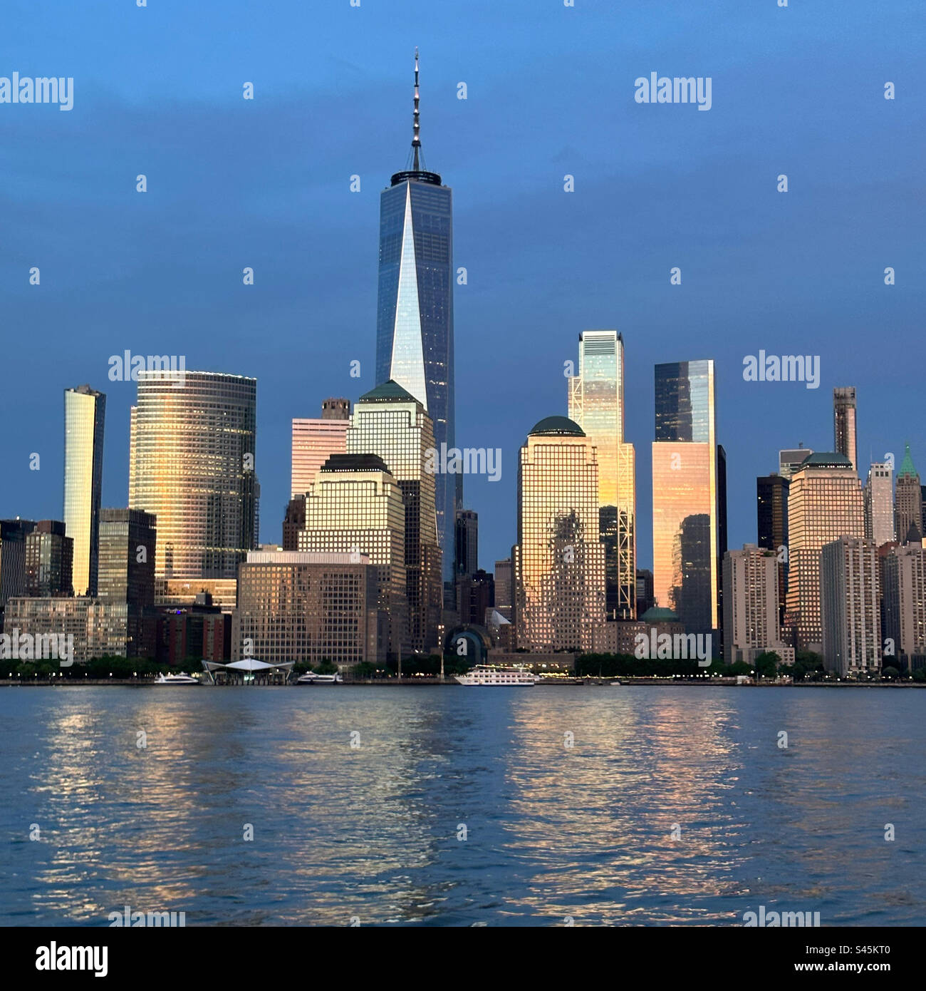 Sunset reflected in Lower Manhattan skyscrapers, New York, New York, United States - Smartphone Captured Stock Image