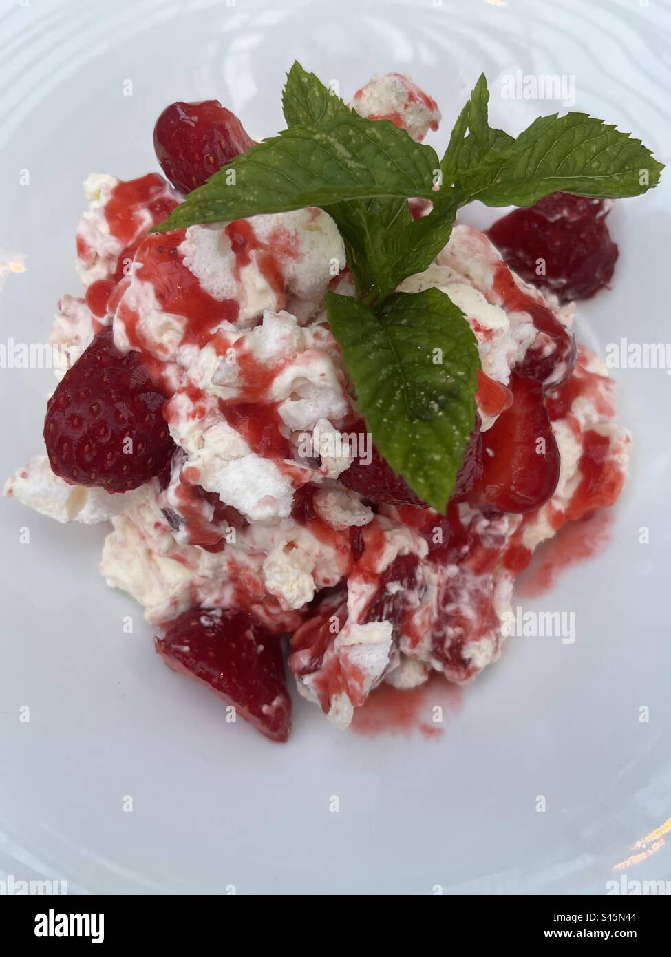 A fabulous Eaton Mess pudding topped with mint. What could possibly be better ! - Smartphone Captured Stock Image