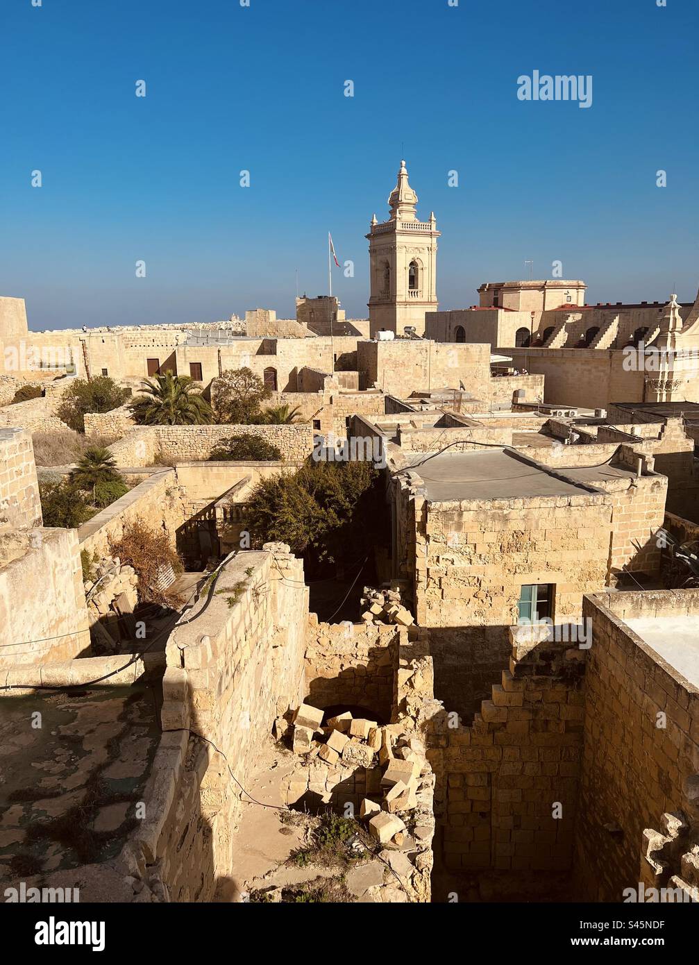 Flat roofs and a cathedral tower of the old town Victoria on the Gozo island, Malta - Smartphone Captured Stock Image