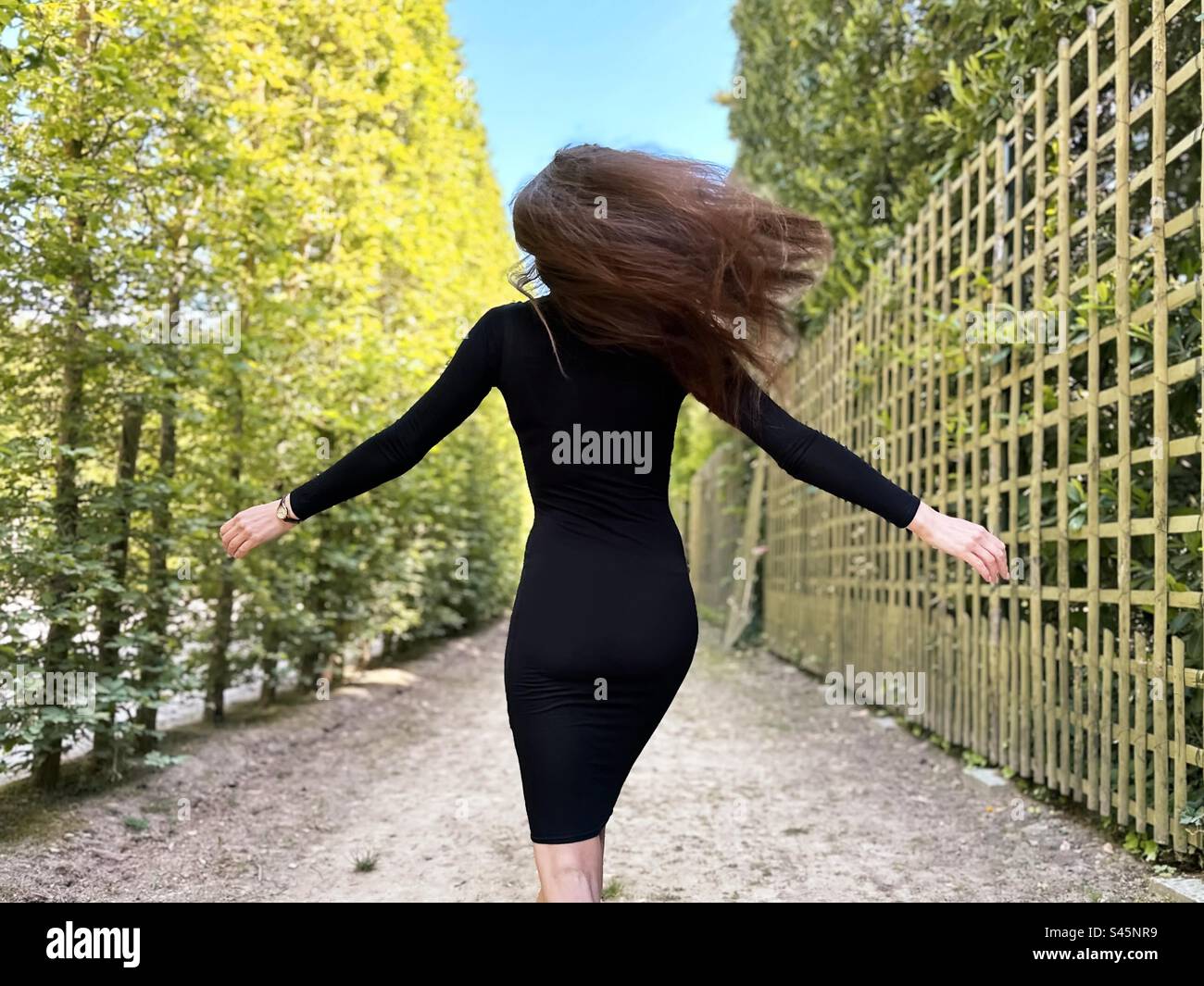 Young happy healthy woman with long hair - Smartphone Captured Stock Image