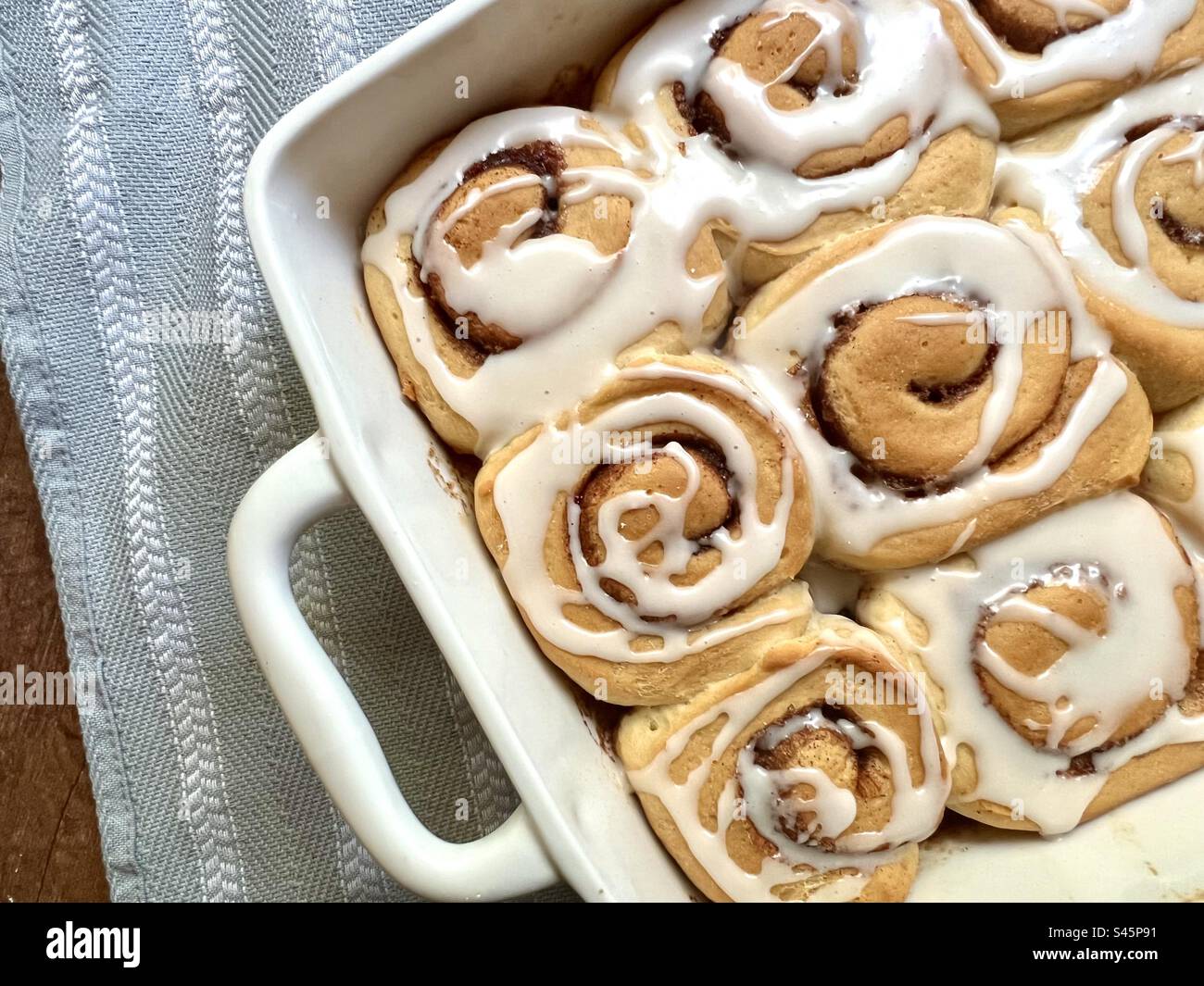 Cinnamon rolls in a white baking dish - Smartphone Captured Stock Image