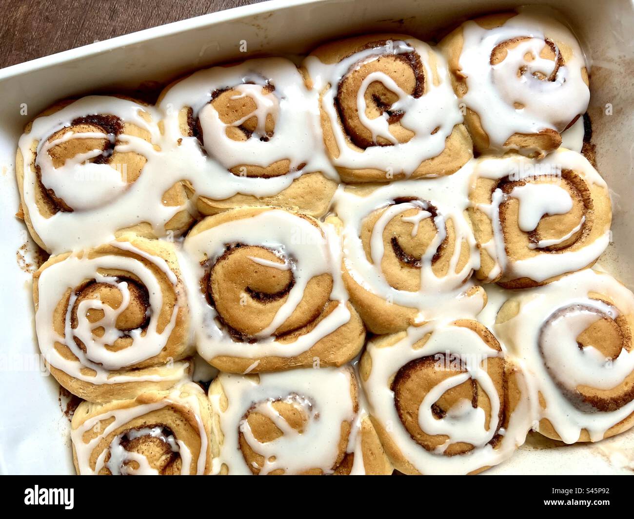 Cinnamon rolls in a white baking dish - Smartphone Captured Stock Image