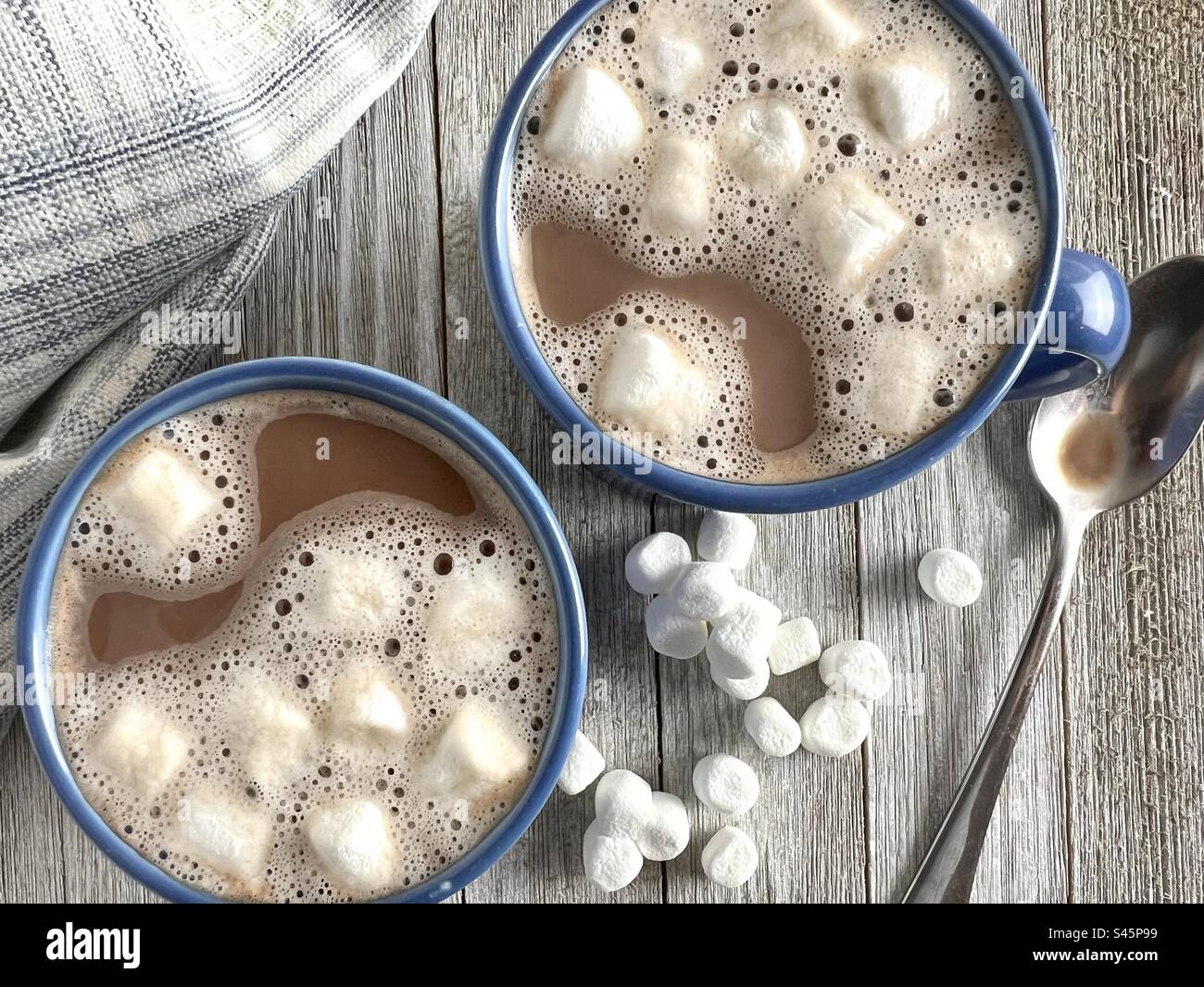 Hot chocolate in blue mugs Stock Photo